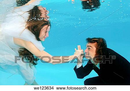 Bridal couple, underwater wedding in pool View Large Photo Image Picture - Bridal couple, underwater wedding in pool. Fotosearch