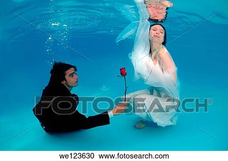 Bridal couple, underwater wedding in pool View Large Photo Image Stock Image - Bridal couple, underwater wedding in pool. Fotosearch