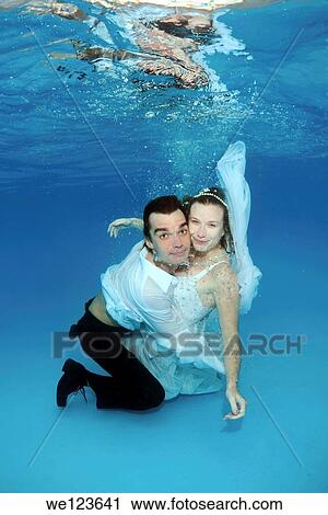 Bridal couple, underwater wedding in pool View Large Photo Image Stock Image - Bridal couple, underwater wedding in pool. Fotosearch