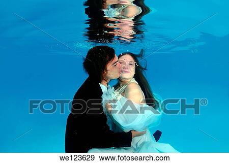Bridal couple, underwater wedding in pool View Large Photo Image Stock Photo - Bridal couple, underwater wedding in pool. Fotosearch