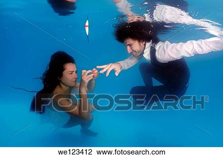 Bride and groom, ring, underwater wedding in pool, Odessa, Ukraine, Eastern Europe View Large Photo Image Stock Image - Bride and groom, ring, underwater wedding in pool, Odessa, Ukraine, Eastern Europe. Fotosearch
