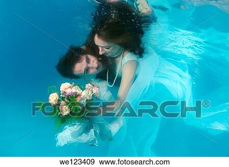 Bride and groom, ring, underwater wedding in pool, Odessa, Ukraine, Eastern Europe View Large Photo Image Stock Photo - Bride and groom, ring, underwater wedding in pool, Odessa, Ukraine, Eastern Europe. Fotosearch