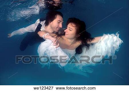 Bride and groom, ring, underwater wedding in pool, Odessa, Ukraine, Eastern Europe View Large Photo Image Stock Photo - Bride and groom, ring, underwater wedding in pool, Odessa, Ukraine, Eastern Europe. Fotosearch
