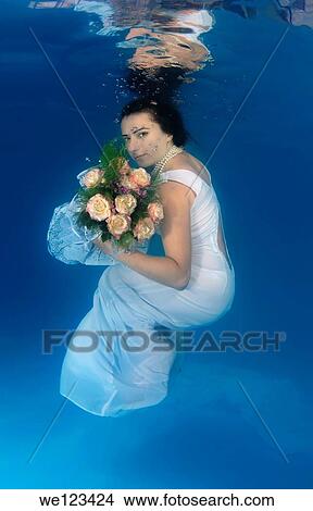 Bride, underwater wedding in a pool, Odessa, Ukraine, Eastern Europe View Large Photo Image Picture - Bride, underwater wedding in a pool, Odessa, Ukraine, Eastern Europe. Fotosearch