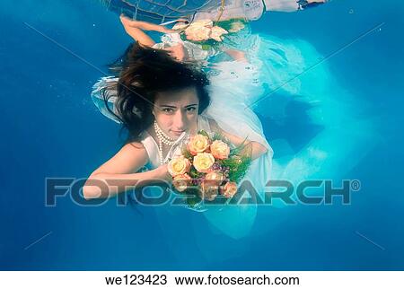 Bride, underwater wedding in a pool, Odessa, Ukraine, Eastern Europe View Large Photo Image Stock Image - Bride, underwater wedding in a pool, Odessa, Ukraine, Eastern Europe. Fotosearch
