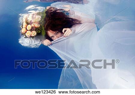 Bride, underwater wedding in a pool, Odessa, Ukraine, Eastern Europe View Large Photo Image Stock Photograph - Bride, underwater wedding in a pool, Odessa, Ukraine, Eastern Europe. Fotosearch