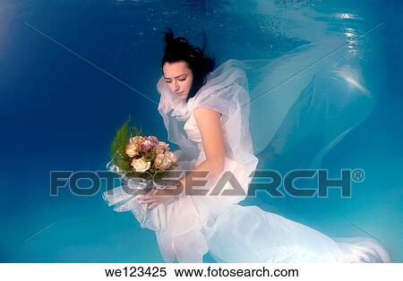 Bride, underwater wedding in a pool, Odessa, Ukraine, Eastern Europe View Large Photo Image Stock Photography - Bride, underwater wedding in a pool, Odessa, Ukraine, Eastern Europe. Fotosearch