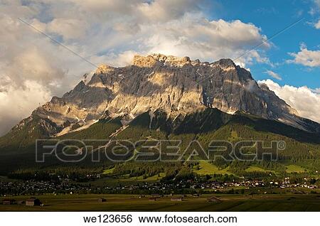 Stock Photograph - Evening light at the Wetterstein Mountains above the Ehrwalder Becken valley in the Zugspitz Arena, Ehrwald, Tyrol, Austria. Fotosearch
