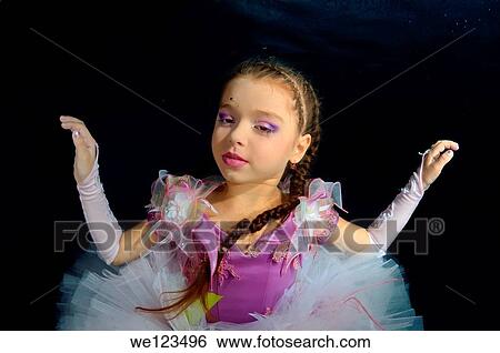 Girl presenting underwater fashion in pool View Large Photo Image Stock Photograph - Girl presenting underwater fashion in pool. Fotosearch