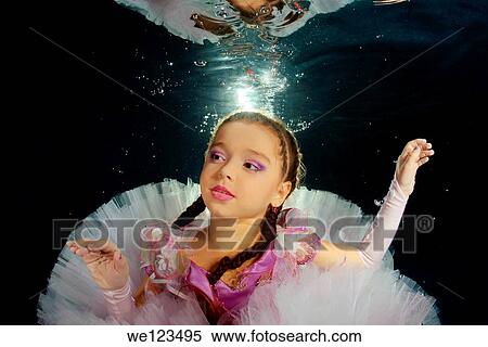 Girl presenting underwater fashion in pool View Large Photo Image Stock Photography - Girl presenting underwater fashion in pool. Fotosearch