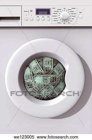 Money Laundry - a washing machine with Indian currency notes inside View Large Photo Image Stock Photography - Money Laundry - a washing machine with Indian currency notes inside. Fotosearch