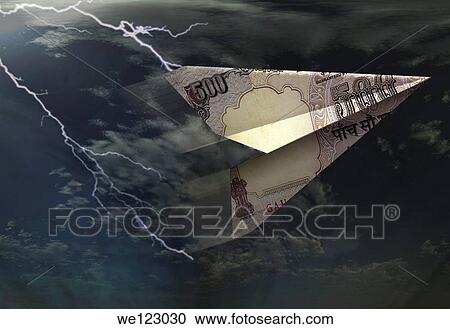 Paper airplane flying through the storm View Large Photo Image Stock Image - Paper airplane flying through the storm. Fotosearch
