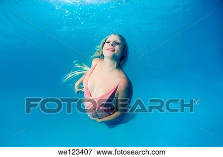 pregnant woman, underwater fashion in a pool View Large Photo Image Stock Photo - pregnant woman, underwater fashion in a pool. Fotosearch