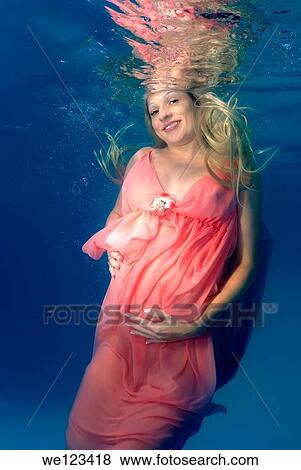 pregnant woman, underwater fashion in a pool View Large Photo Image Stock Photo - pregnant woman, underwater fashion in a pool. Fotosearch