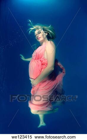 pregnant woman, underwater fashion in a pool View Large Photo Image Stock Photography - pregnant woman, underwater fashion in a pool. Fotosearch