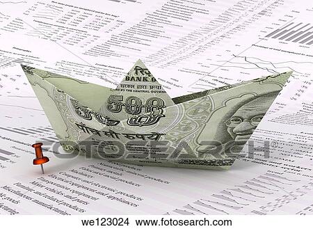 Picture - Sailing boat made of Indian currency note on stock listing paper. Fotosearch