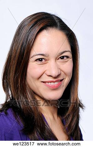Smiling young lady with a white background View Large Photo Image Stock Photo - Smiling young lady with a white background. Fotosearch