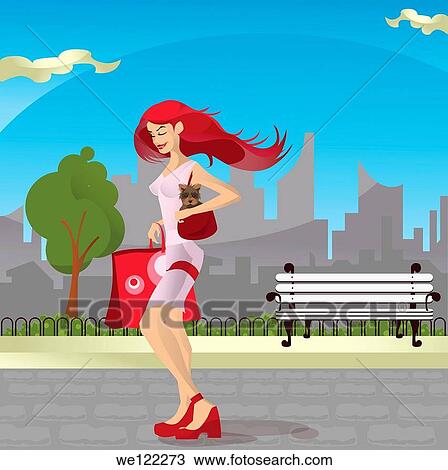 Stock Image - Teenage girl carrying a cat in her purse. Fotosearch