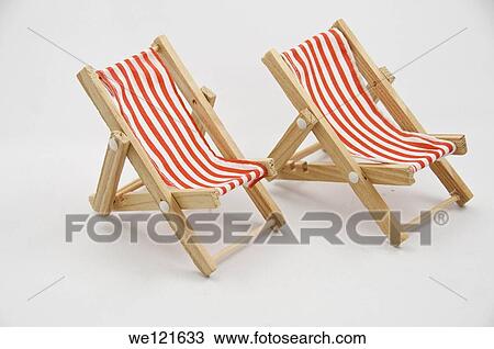 Two miniture chairs on a white background View Large Photo Image Stock Image - Two miniture chairs on a white background. Fotosearch