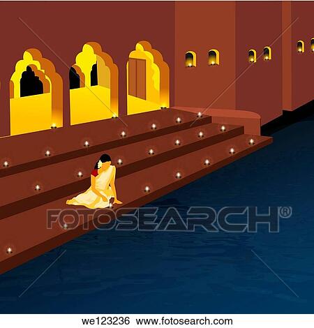 Woman arranging oil lamps at a festival, India View Large Photo Image Stock Photograph - Woman arranging oil lamps at a festival, India. Fotosearch