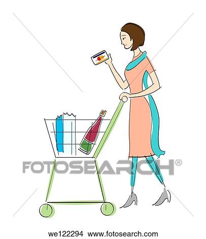 Woman holding a credit card and walking with a shopping cart View Large Photo Image Picture - Woman holding a credit card and walking with a shopping cart. Fotosearch