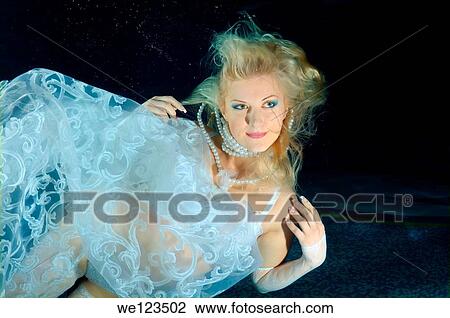 Woman, underwater model presenting fashion in pool View Large Photo Image Stock Image - Woman, underwater model presenting fashion in pool. Fotosearch