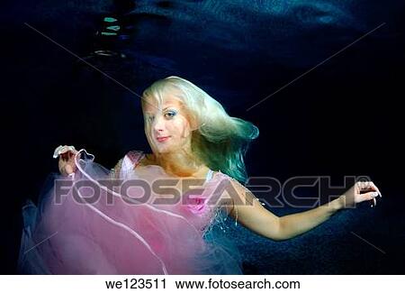 Woman, underwater model presenting fashion in pool View Large Photo Image Stock Image - Woman, underwater model presenting fashion in pool. Fotosearch