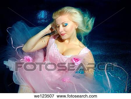 Woman, underwater model presenting fashion in pool View Large Photo Image Stock Photo - Woman, underwater model presenting fashion in pool. Fotosearch