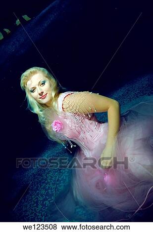 Woman, underwater model presenting fashion in pool View Large Photo Image Stock Photo - Woman, underwater model presenting fashion in pool. Fotosearch