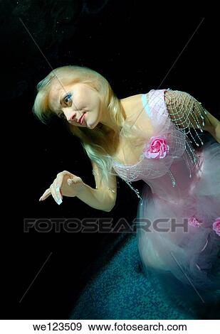 Woman, underwater model presenting fashion in pool View Large Photo Image Stock Photo - Woman, underwater model presenting fashion in pool. Fotosearch