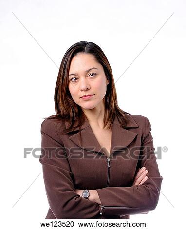Young women has her arms crossed She is of mixed race Wearing a brown suit and has long brown hair View Large Photo Image Stock Image - Young women has her arms crossed She is of mixed race Wearing a brown suit and has long brown hair. Fotosearch