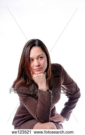 Young women has her chin resting on her hand, She is leaning forward and is of filipino ethnicity It is on a white background View Large Photo Image Stock Image - Young women has her chin resting on her hand, She is leaning forward and is of filipino ethnicity It is on a white background. Fotosearch