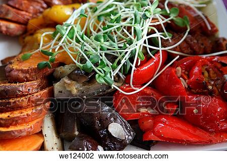 Stock Image - A plate of Italian style Antipasti with Courgette, Mushroom, Sweet Potato, Aubergine, Onion and Garlic.. Fotosearch