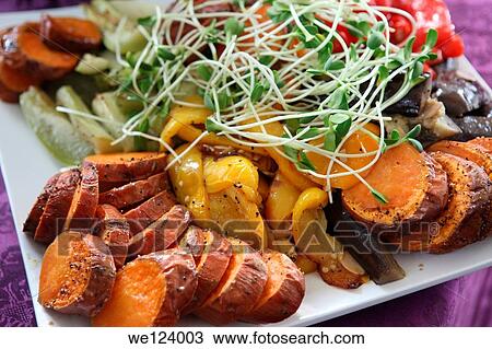 Stock Image - A plate of Italian style Antipasti with Courgette, Mushroom, Sweet Potato, Aubergine, Onion and Garlic.. Fotosearch