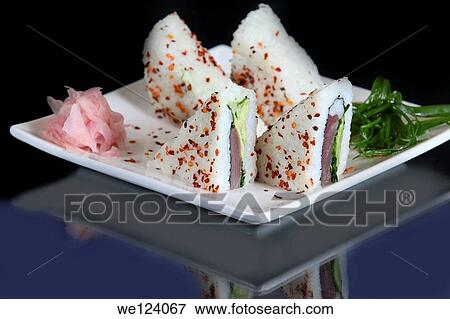 Stock Photo - An assortment of insideout Sushi to be served.. Fotosearch