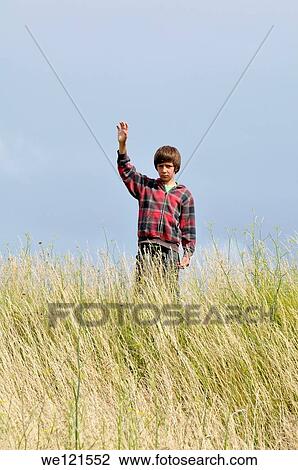 Stock Image - Boy says hello. Fotosearch