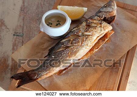 Grilled fish with lemon. View Large Photo Image Stock Photo - Grilled fish with lemon.. Fotosearch