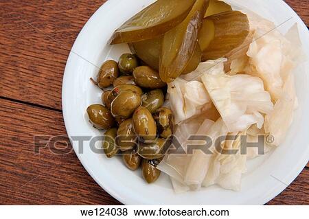 Plate of pickled vegetables cucumber, cabbage and olives. View Large Photo Image Stock Photo - Plate of pickled vegetables cucumber, cabbage and olives.. Fotosearch