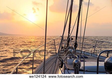 Yacht sailing at sunset along Akamas peninsula, Cyprus. View Large Photo Image Picture - Yacht sailing at sunset along Akamas peninsula, Cyprus.. Fotosearch