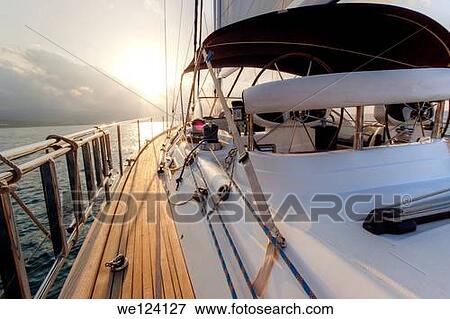 Yacht sailing at sunset along Akamas peninsula, Cyprus. View Large Photo Image Stock Photo - Yacht sailing at sunset along Akamas peninsula, Cyprus.. Fotosearch