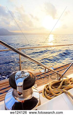Yacht sailing at sunset along Akamas peninsula, Cyprus. View Large Photo Image Stock Photograph - Yacht sailing at sunset along Akamas peninsula, Cyprus.. Fotosearch