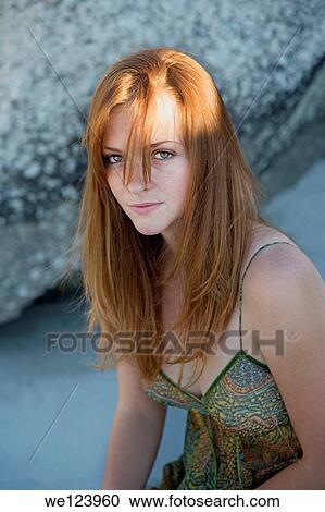 Young Woman On Beach Against Rock. View Large Photo Image Stock Image - Young Woman On Beach Against Rock.. Fotosearch