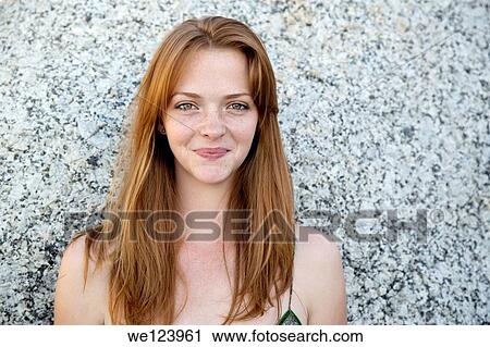 Young Woman On Beach Against Rock. View Large Photo Image Stock Image - Young Woman On Beach Against Rock.. Fotosearch