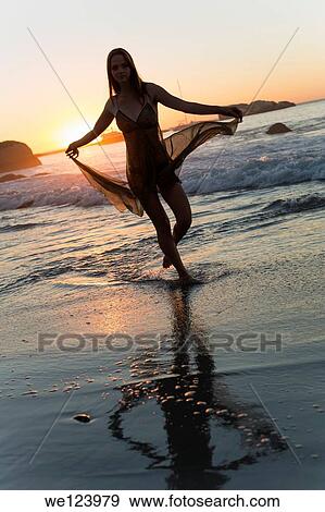 Stock Photo - Young Woman On Beach.. Fotosearch