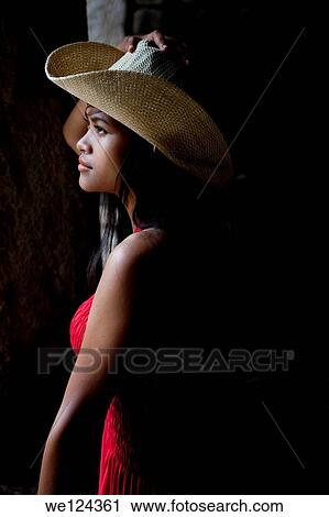 Beautiful Cambodian girl posing and holding her hat inside Bayon temple in Angkor Cambodia. View Large Photo Image Stock Image - Beautiful Cambodian girl posing and holding her hat inside Bayon temple in Angkor Cambodia.. Fotosearch