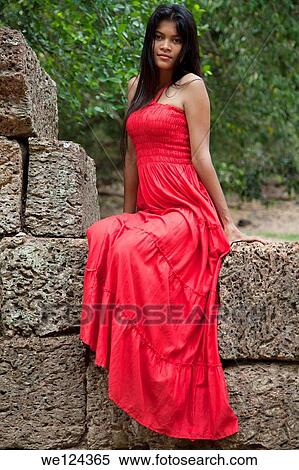 https://fscomps.fotosearch.com/compc/PXT/PXT025/beautiful-cambodian-woman-wearing-a-red-stock-image__we124365.jpg