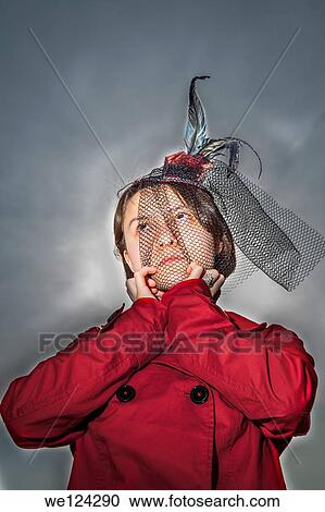 Eurasian teenage girl wearing a red jacket and a hat. View Large Photo Image Stock Image - Eurasian teenage girl wearing a red jacket and a hat.. Fotosearch