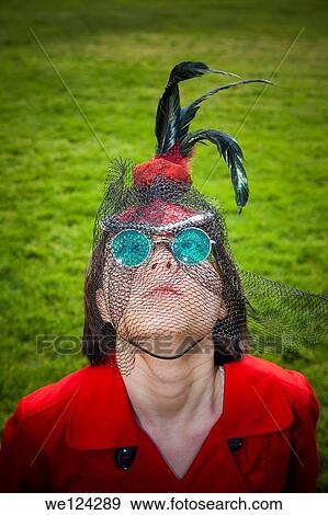 Eurasian teenage girl wearing green sunglasses and a hat on her head. View Large Photo Image Stock Photo - Eurasian teenage girl wearing green sunglasses and a hat on her head.. Fotosearch