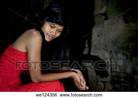 Portrait of a Beautiful Cambodian girl sitting in Bayon temple with shadow projecting on the wall. View Large Photo Image Stock Photograph - Portrait of a Beautiful Cambodian girl sitting in Bayon temple with shadow projecting on the wall.. Fotosearch