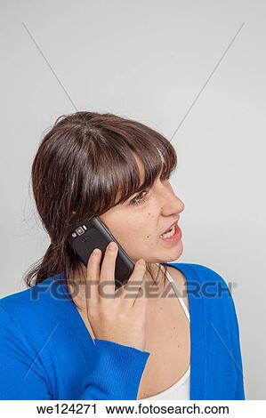 Teen girl talking on a smart phone. View Large Photo Image Stock Image - Teen girl talking on a smart phone.. Fotosearch